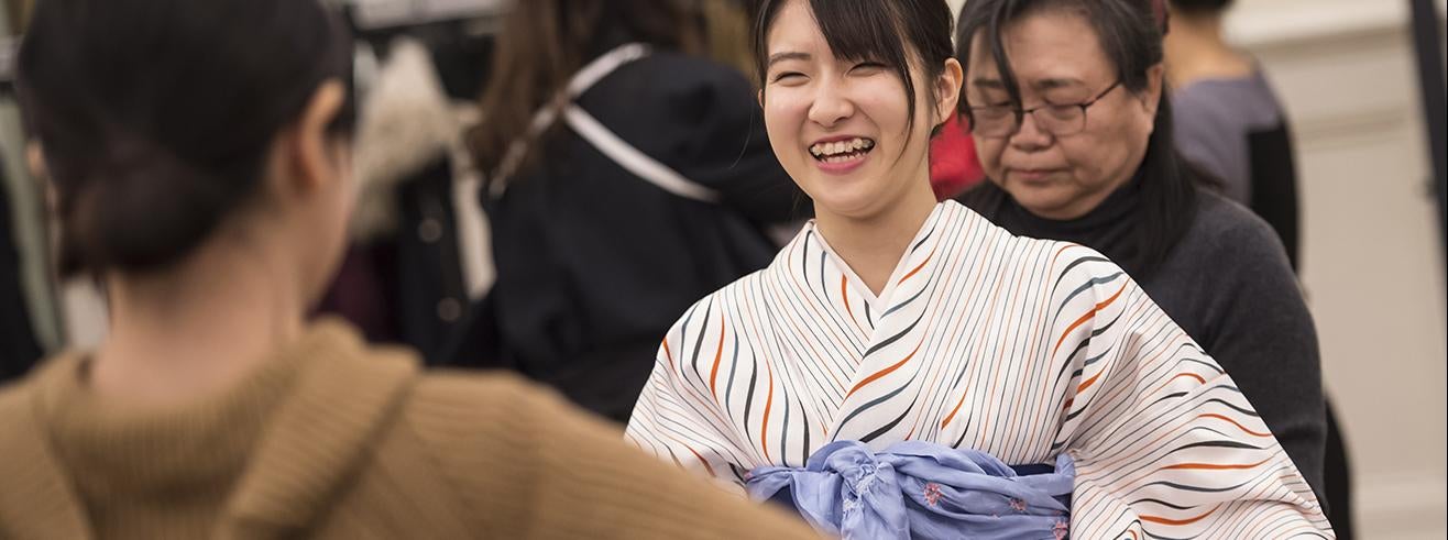 students dress in traditional Japanese kimonos for ceremony