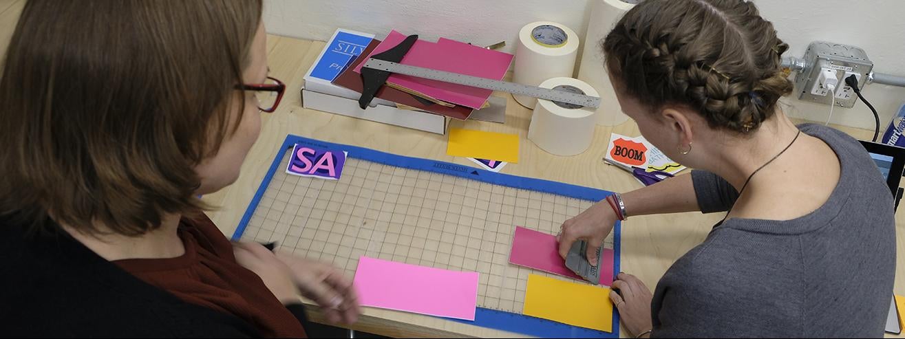 studio arts students creating a paper work