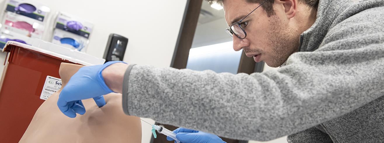 student in Physician Assistant practice lab