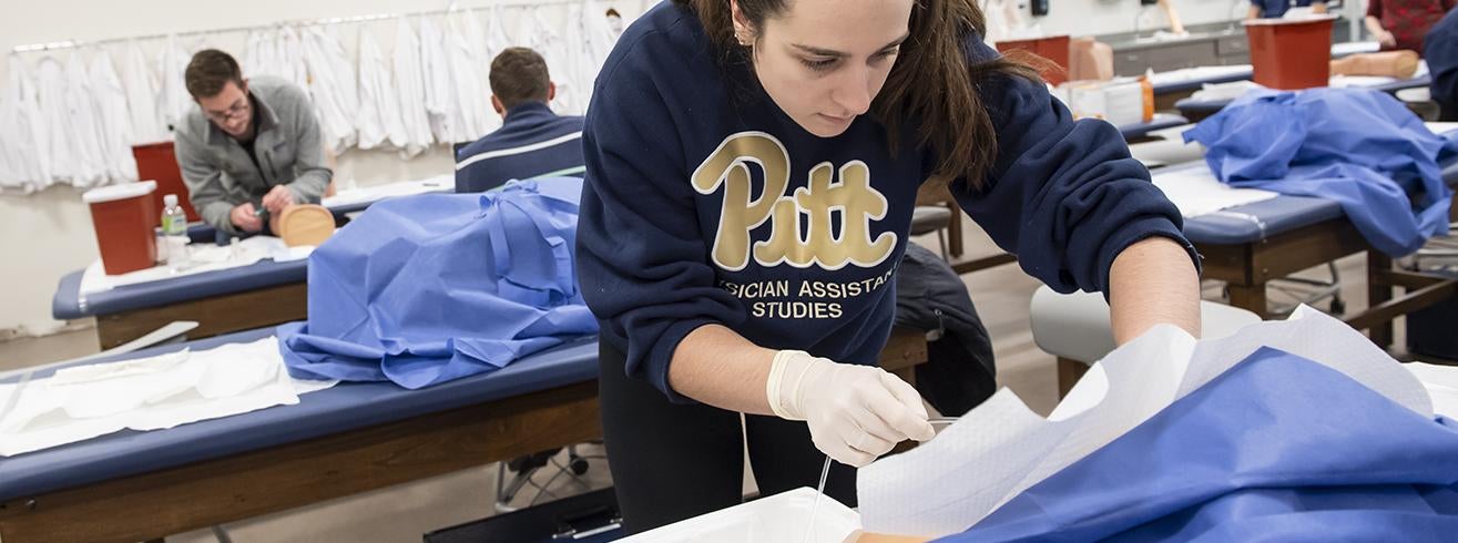 student participating in Physician Assistant practice lab