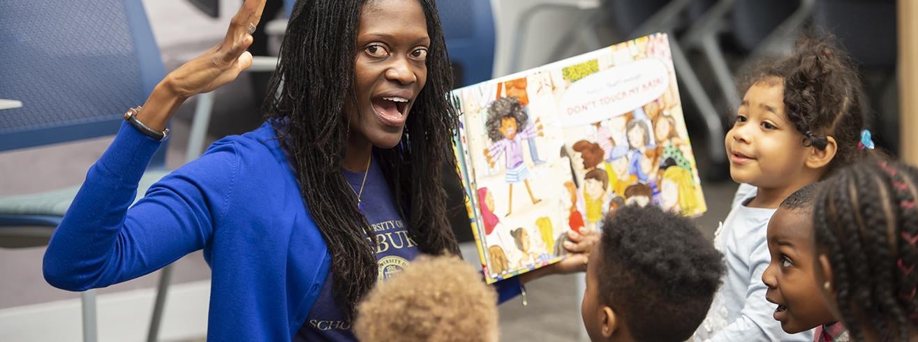 Dean Valerie Kinloch reading to children