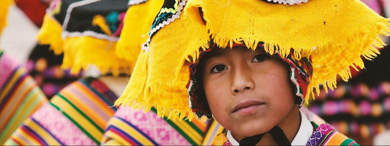 boy in traditional costume cusco peru