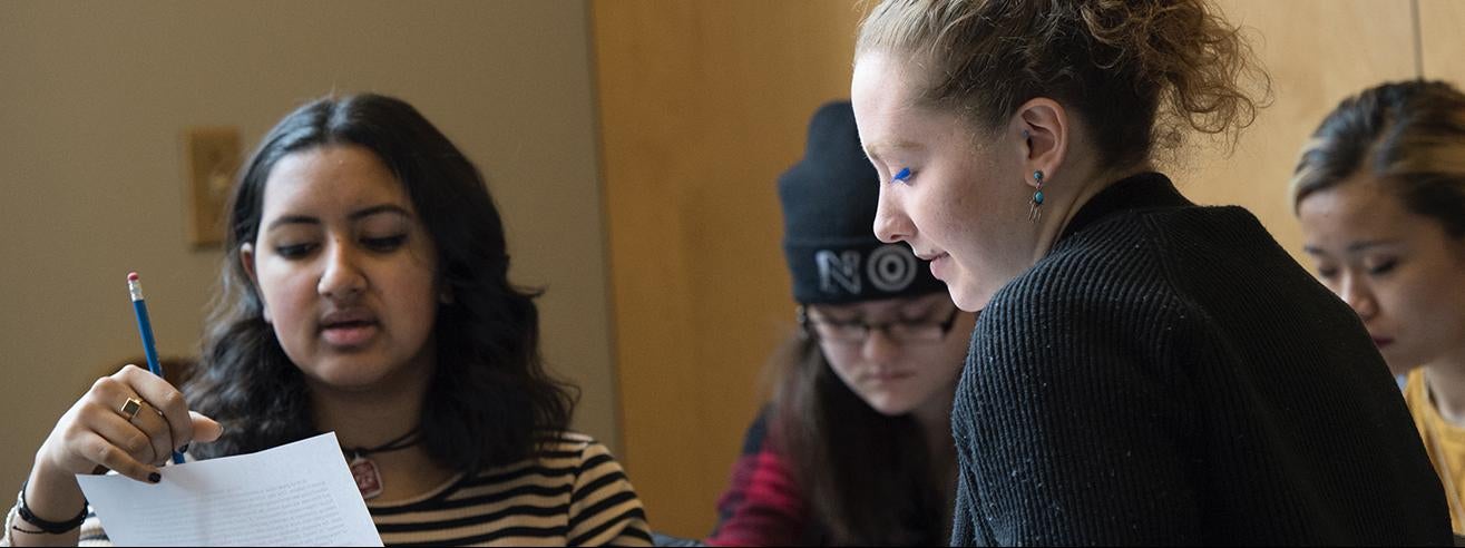 female students gathered in discussion