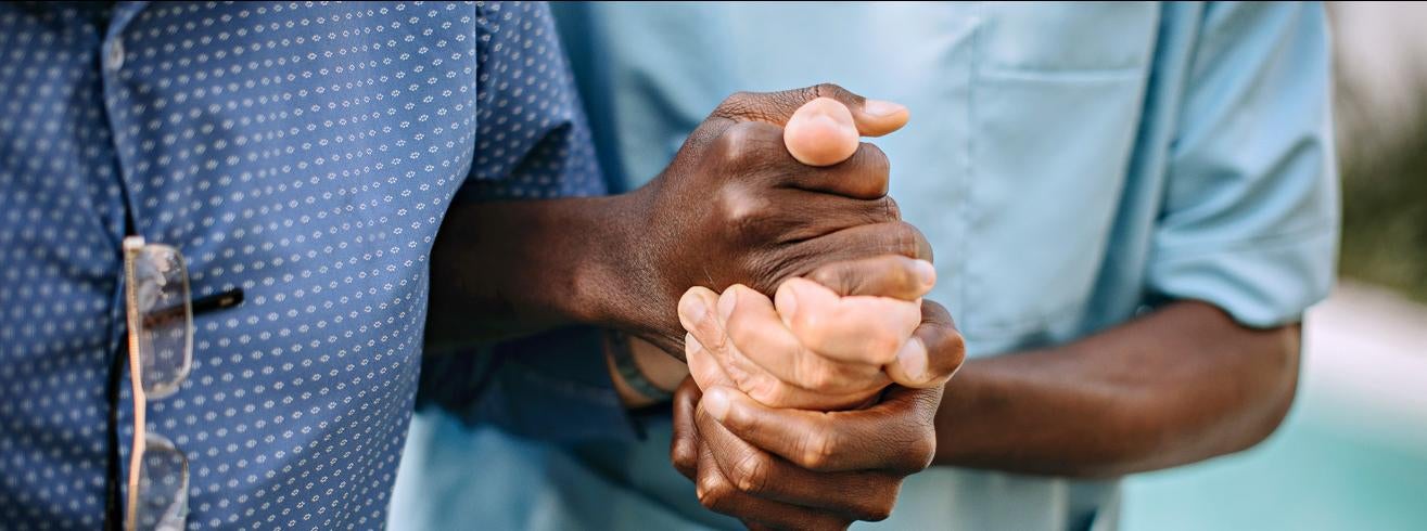 Holding hands with patient