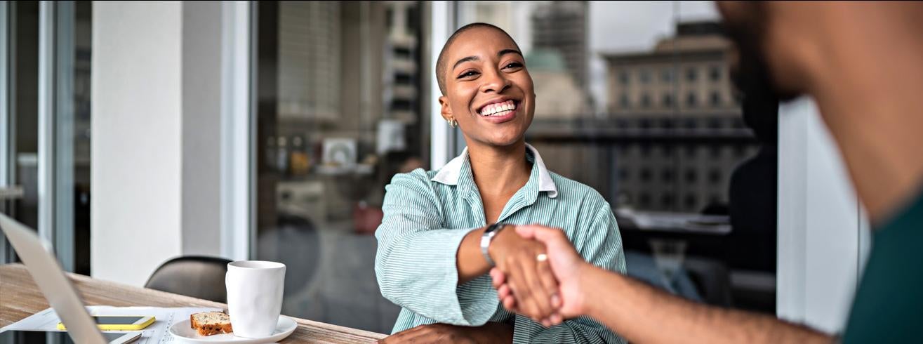 Management Consulting two people shaking hands header image