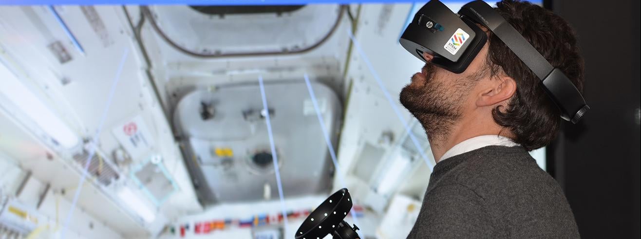 man playing game in VR goggles