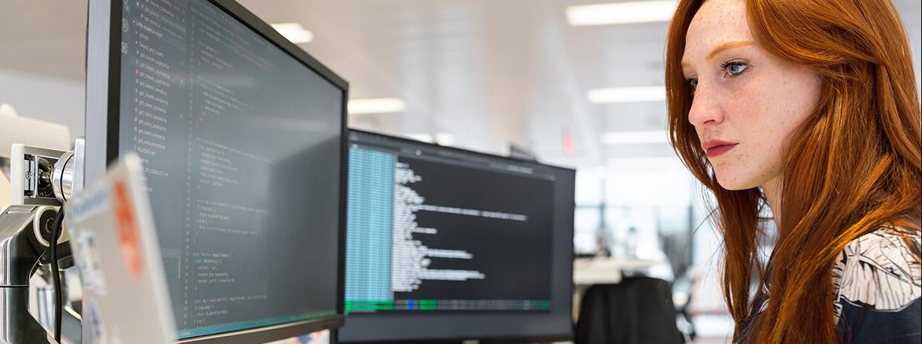 woman with multiple computer screens Photo by ThisIsEngineering from Pexels