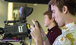 students films with phone during broadcast class
