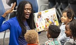 Dean Valerie Kinloch reading to children