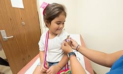 child receiving bandage after vaccine