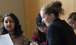 female students gathered in discussion