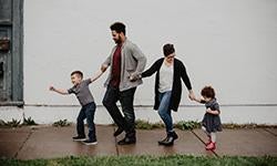 parents walking with two children