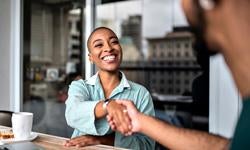 Management Consulting two people shaking hands